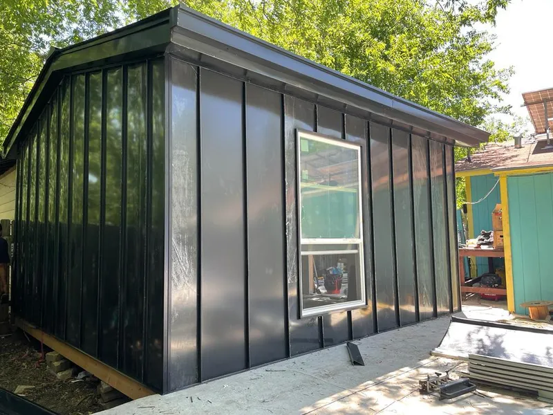 Black standing seam metal wall panels for Roof Inspection in Harrah